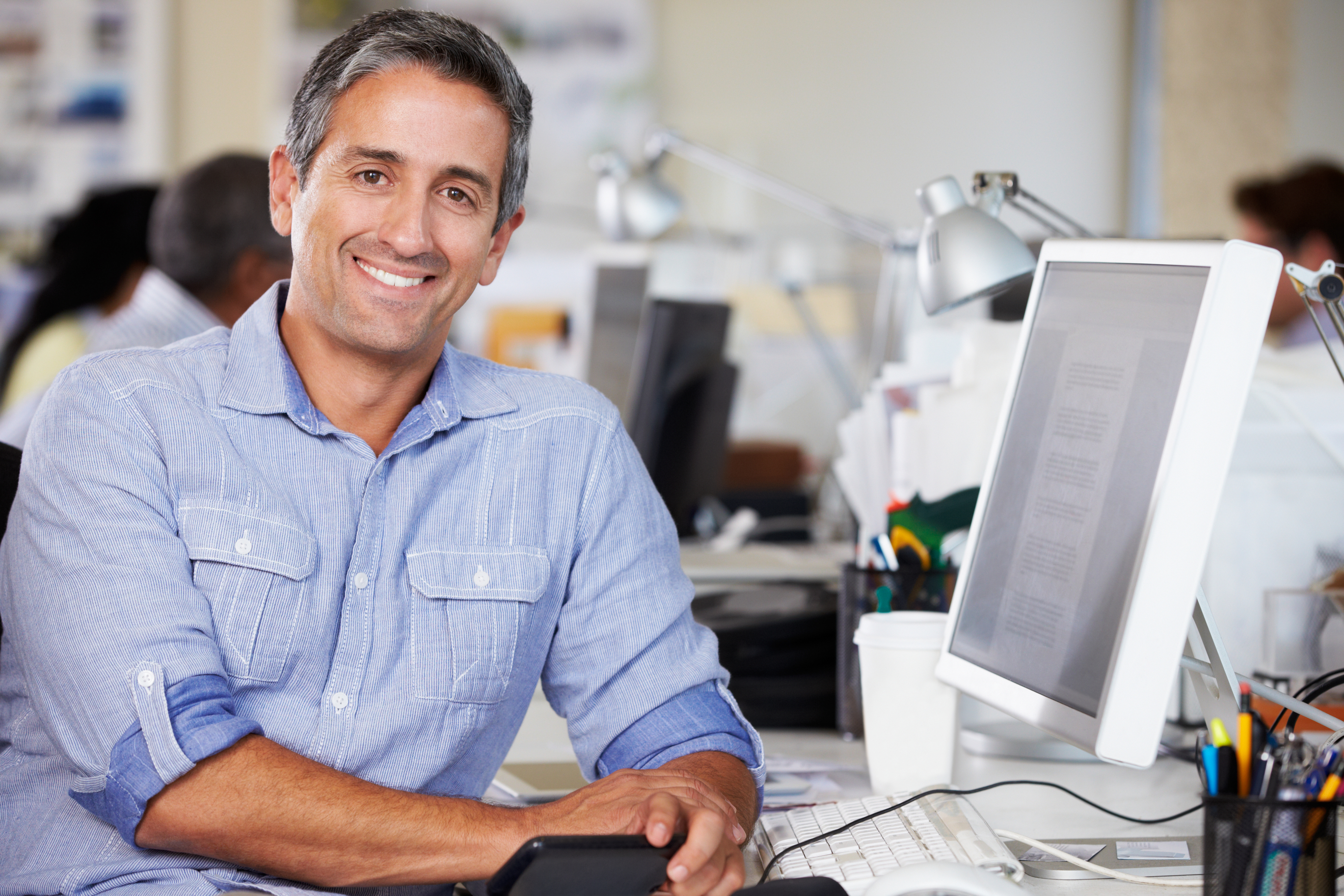 Liberty Oak Properties team member at his desk